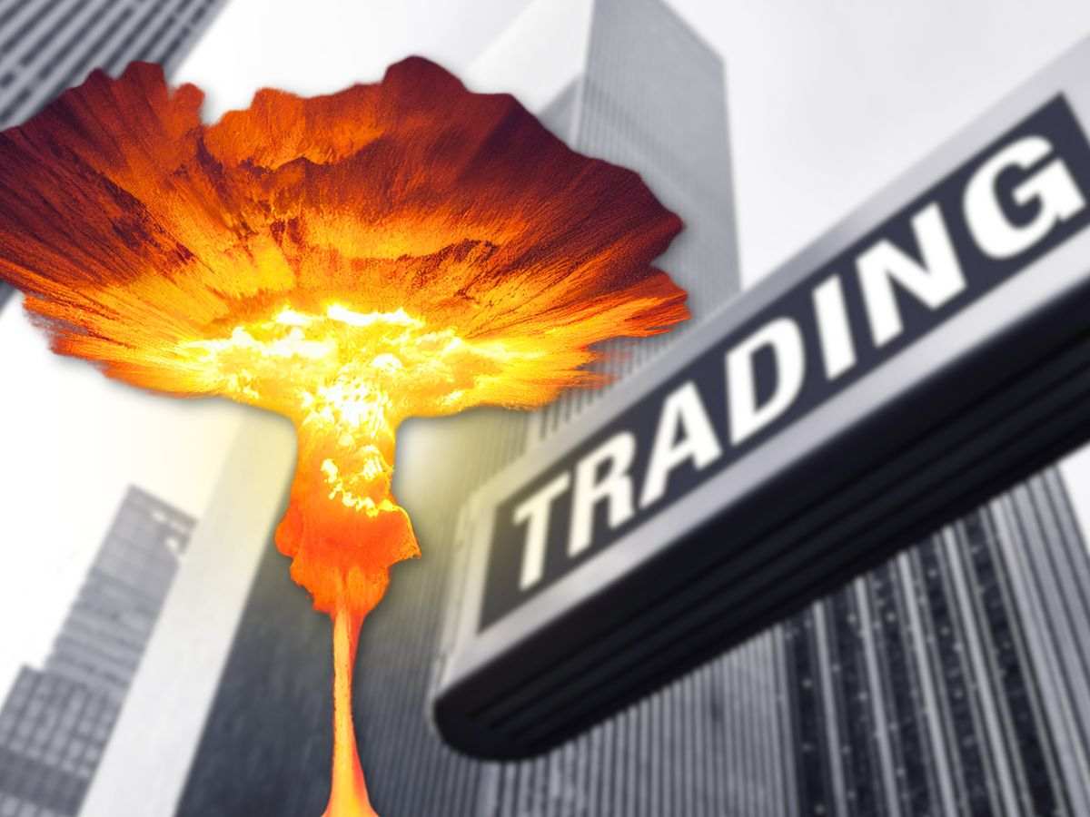 sfondo palazzi con scritta trading e bomba che scoppia